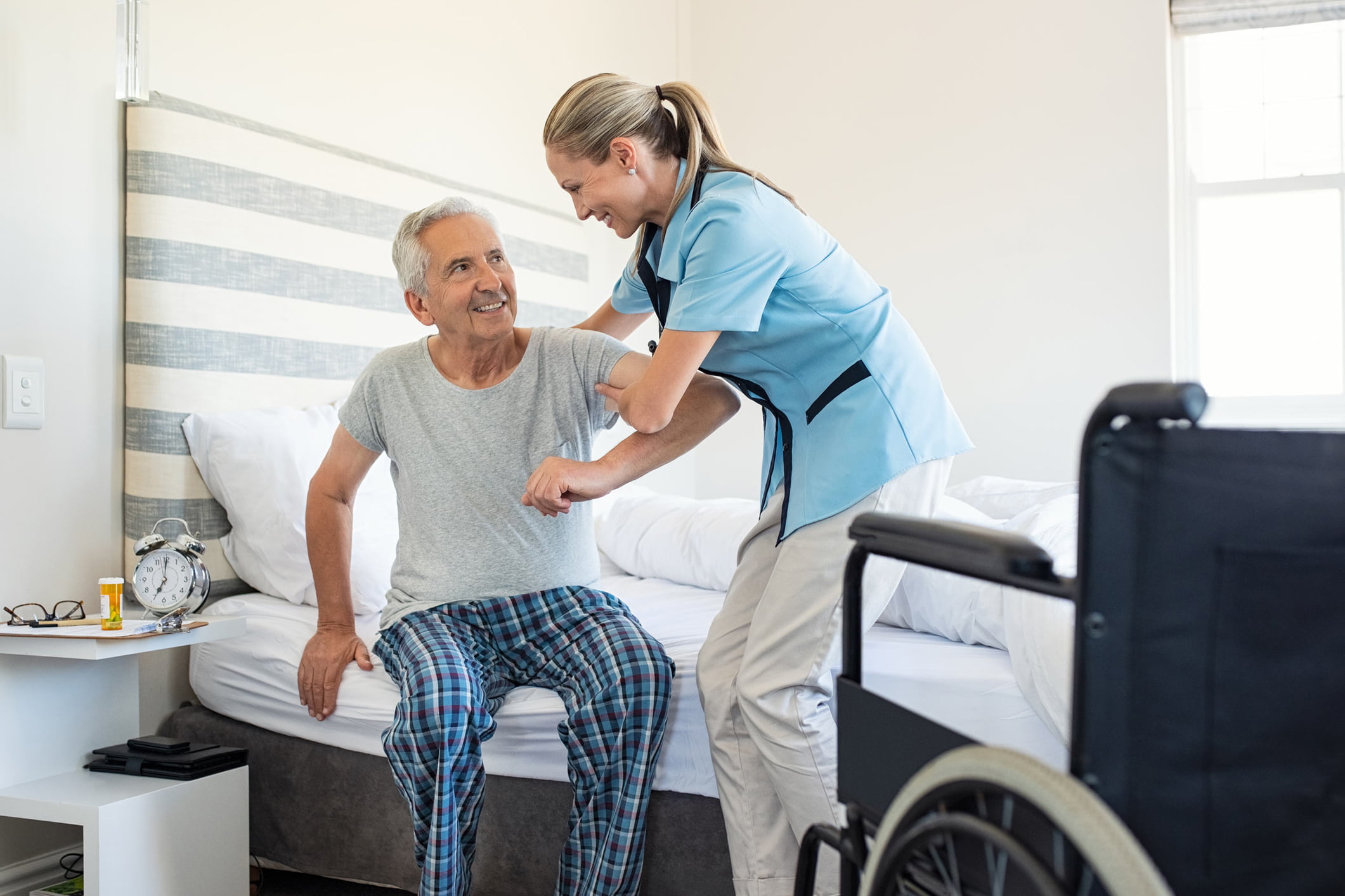 nurse helping old patient small