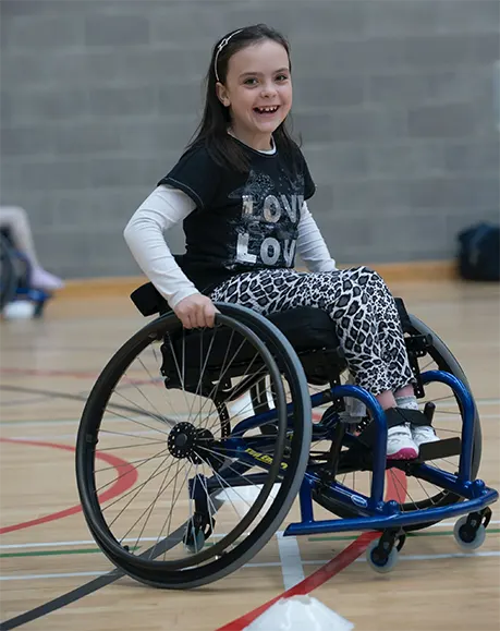 girl smiling wheelchair