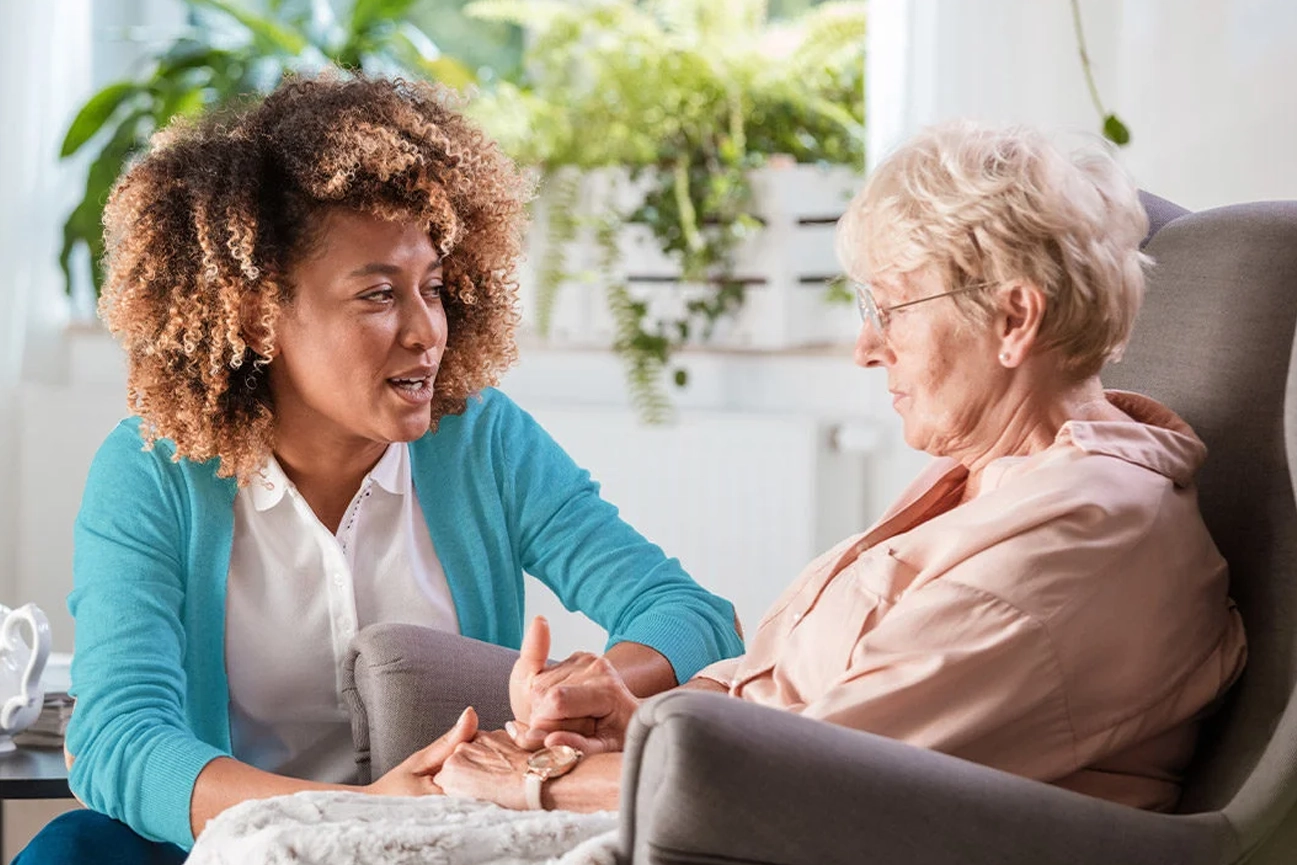 lady supporting elder woman