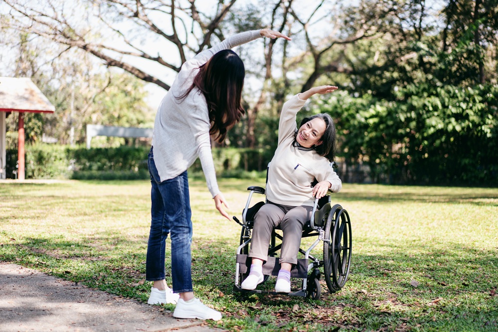 Senior on wheelchair and daughter family concept Young asian wo